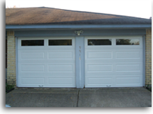 Two new long panel garage doors increase the value of this property.